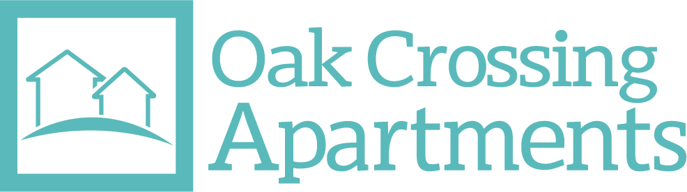The image is a logo for Oak Crossing Apartments, featuring a stylized image of three houses on a hill.